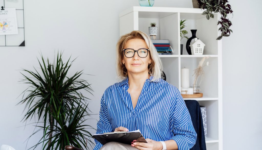 Health professional reviewing documentation in a private practice setting