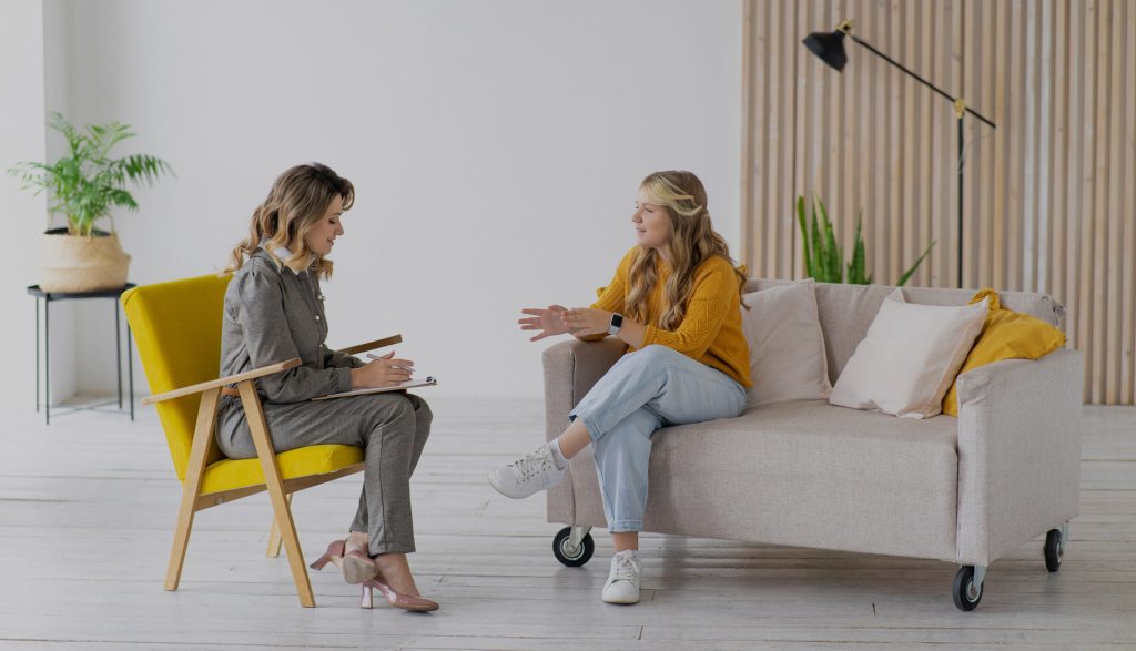 Practitioner speaking with a professional advisor during a consultation